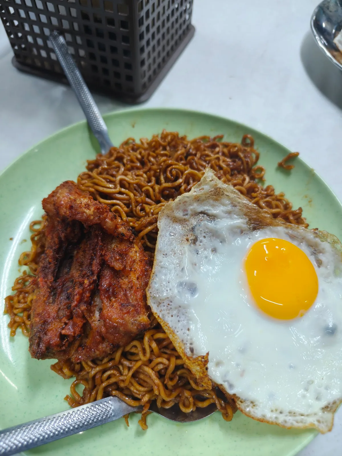 Maggi goreng with fried chicken and egg