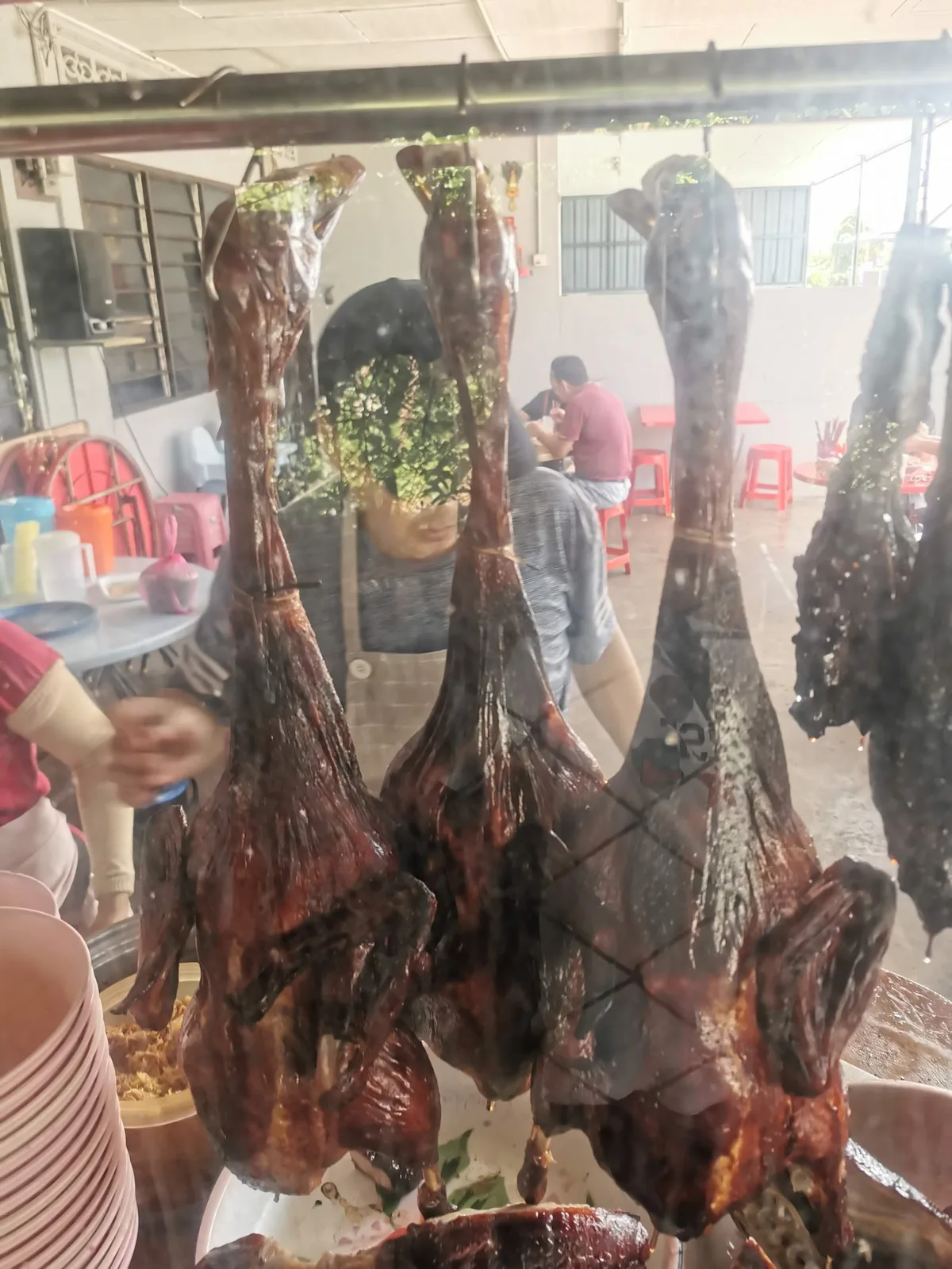 Roast ducks hanging at the stall