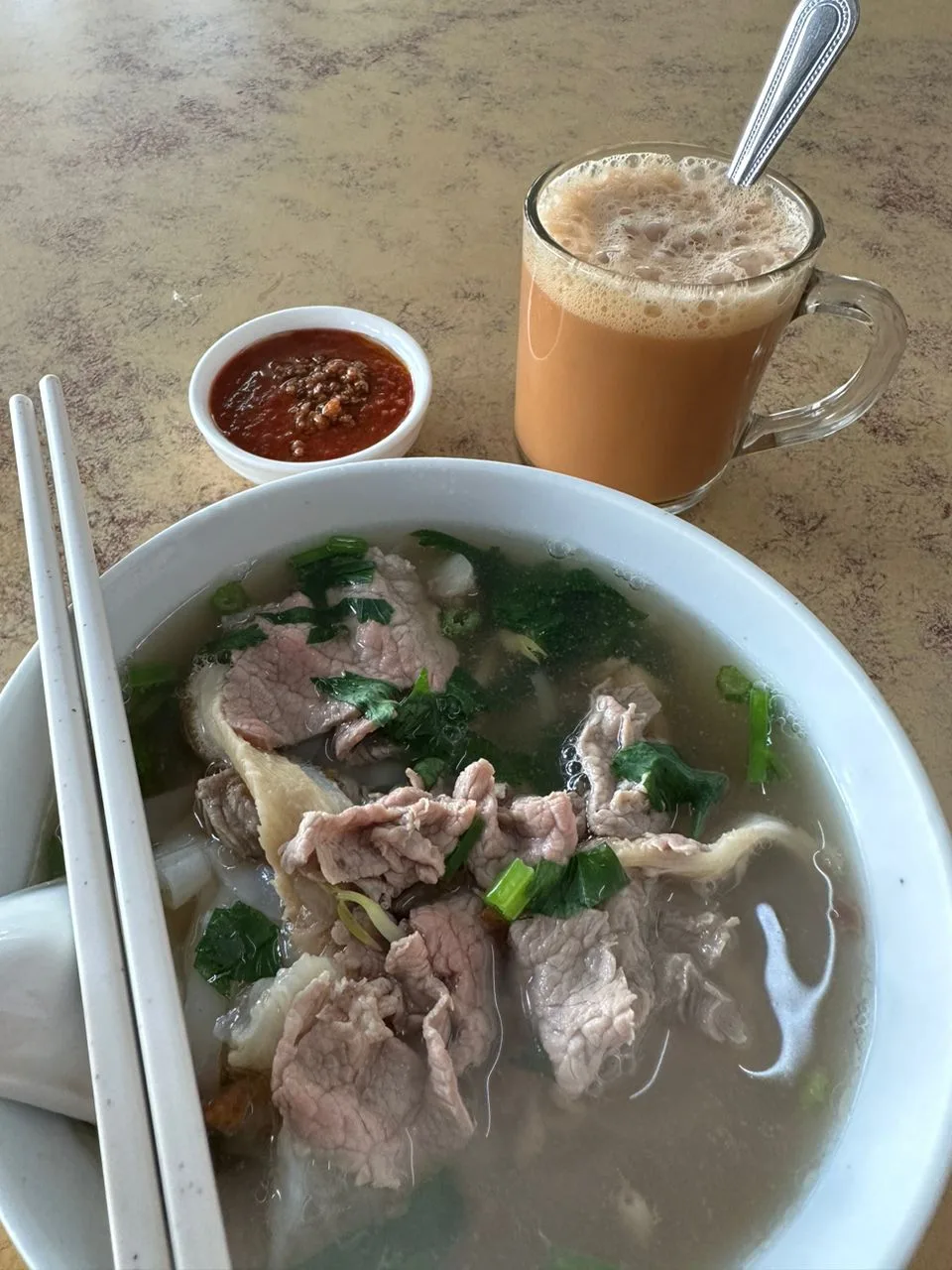 Beef noodle soup with teh tarik