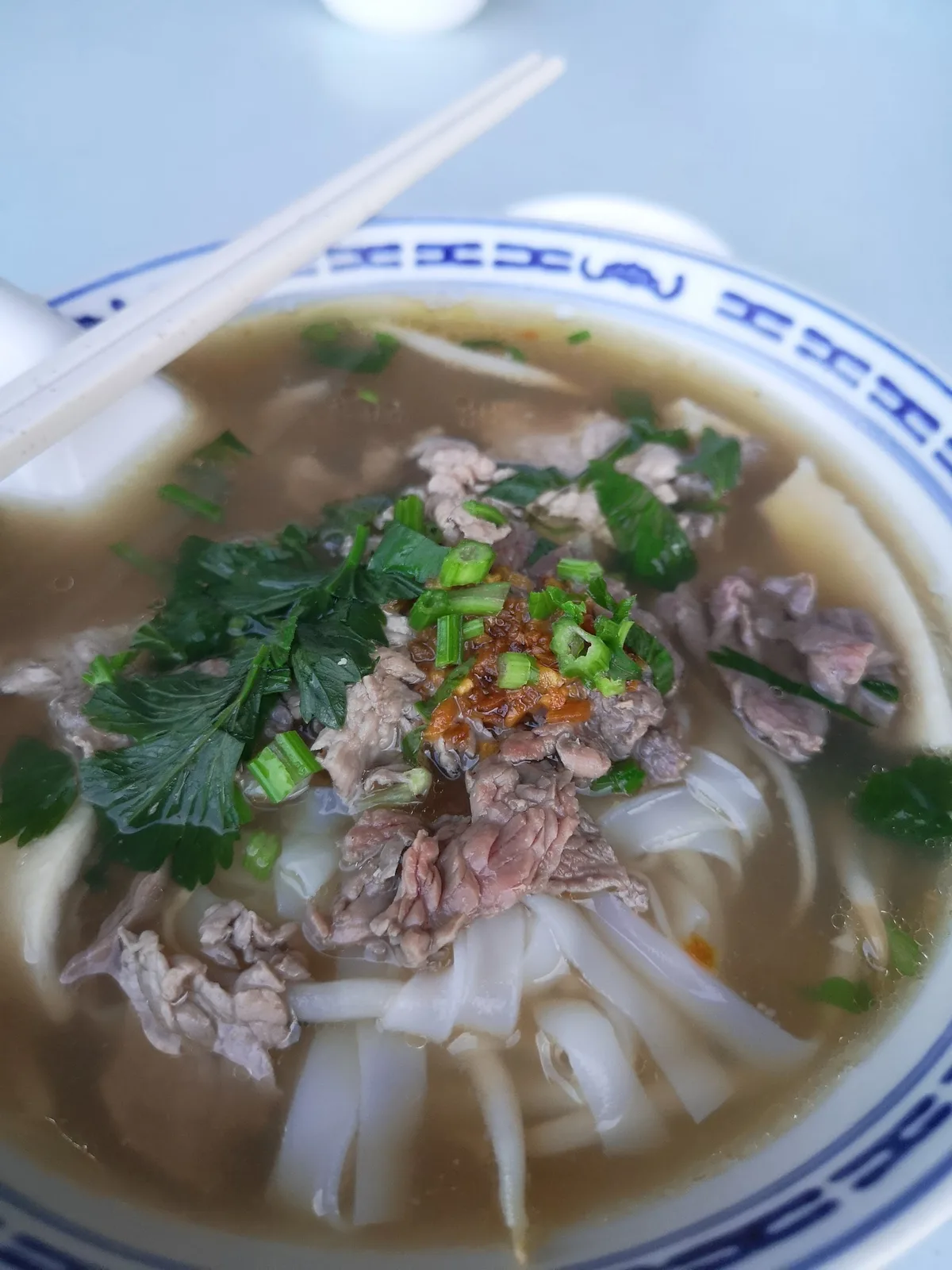 Beef koay teow with chili and coriander