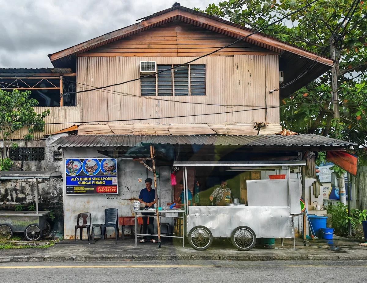 Ali's roadside stall beside the wooden house on Jalan Sungai Pinang