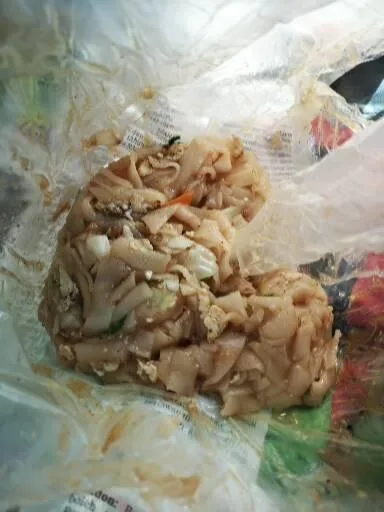 Fried koay teow in its paper wrap