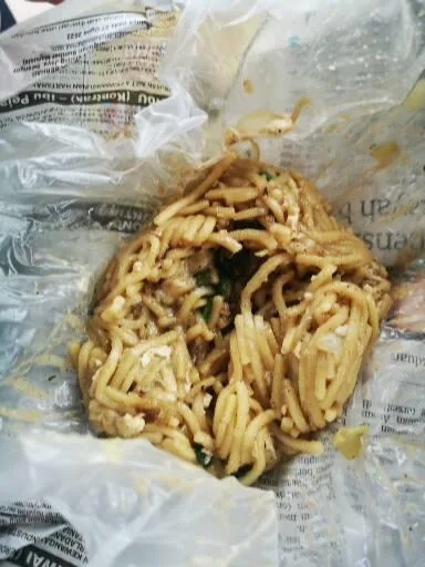 Fried mee in its paper wrap
