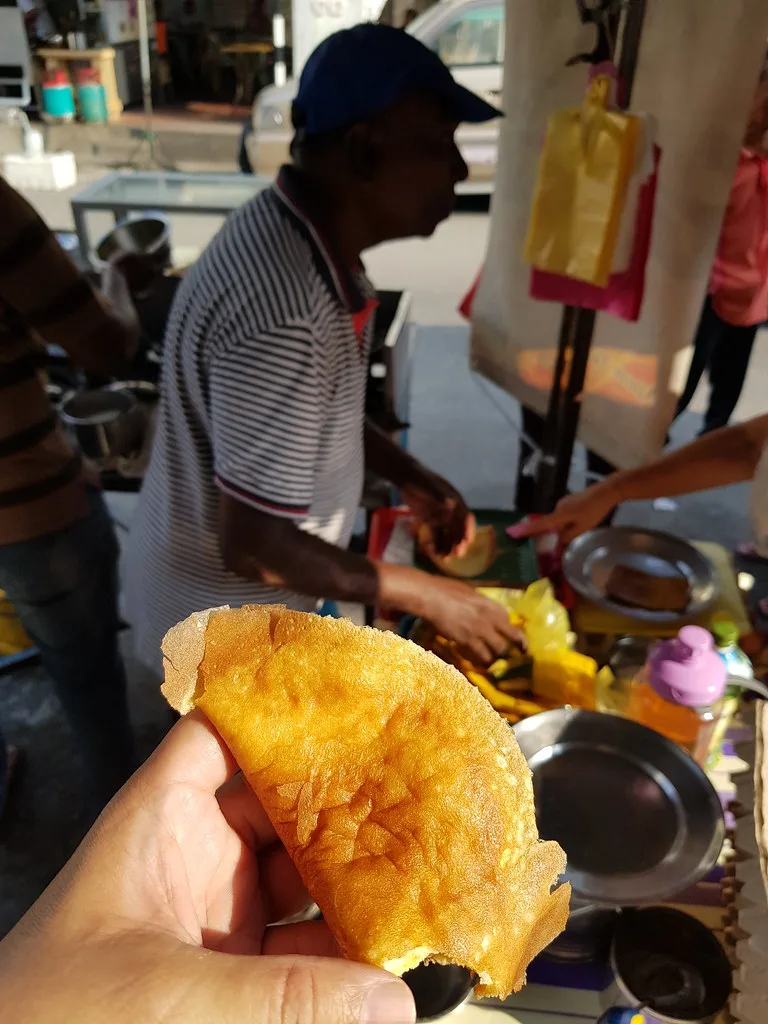 Making apom at the stall