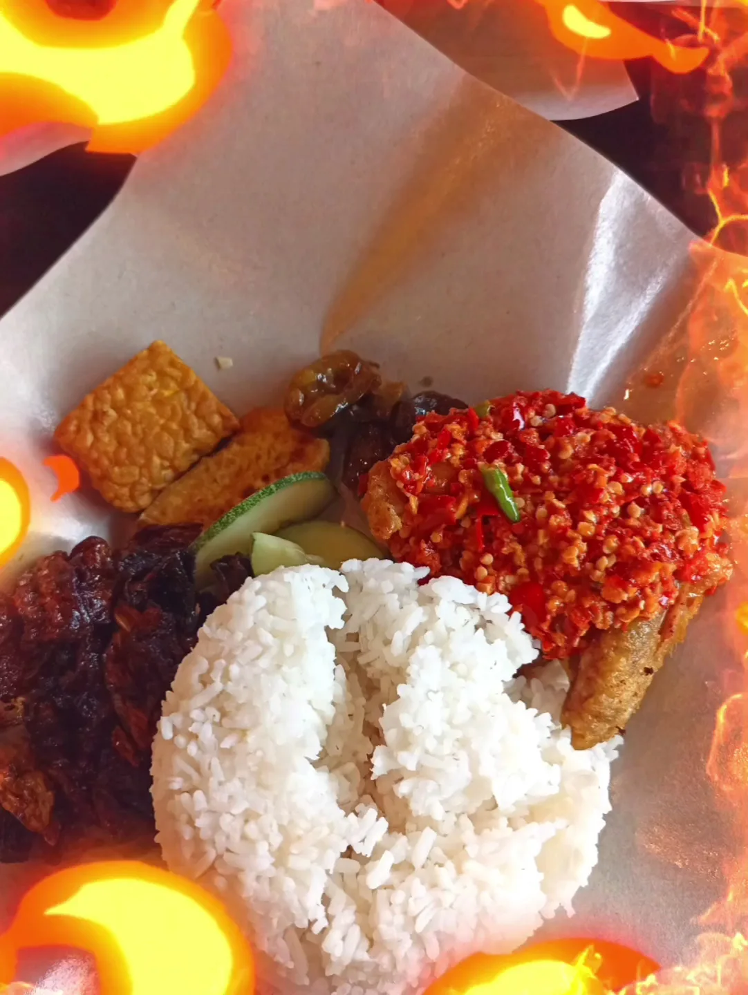Smashed chicken under red sambal