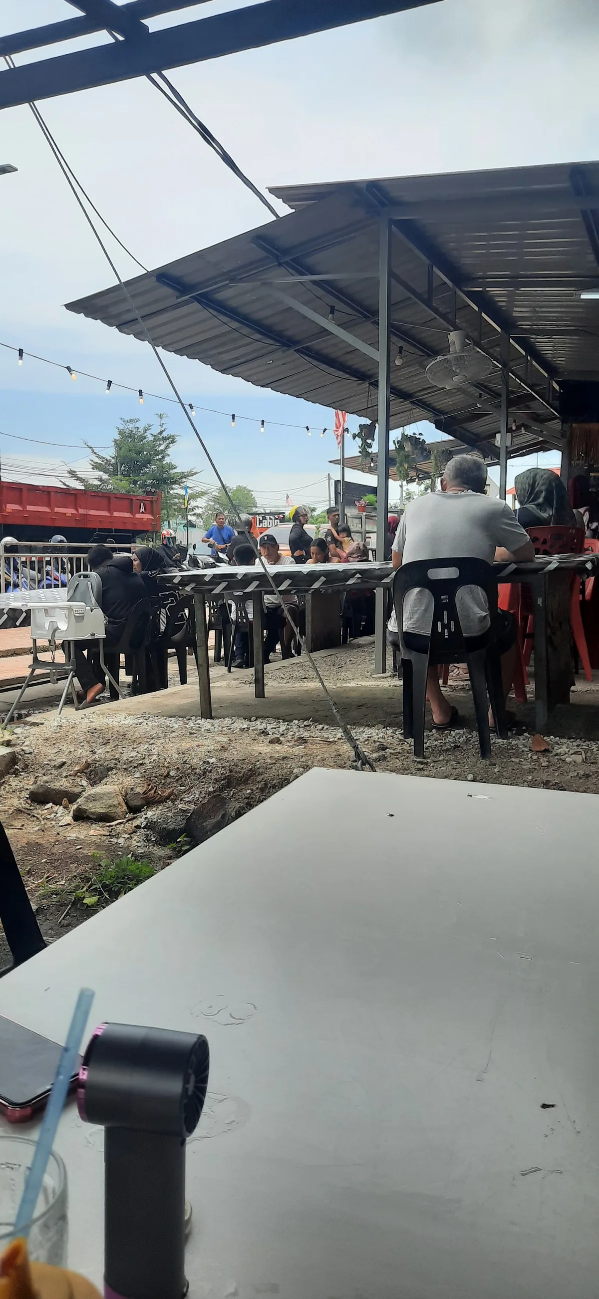 Covered seating area at the Kompleks MBPP stall
