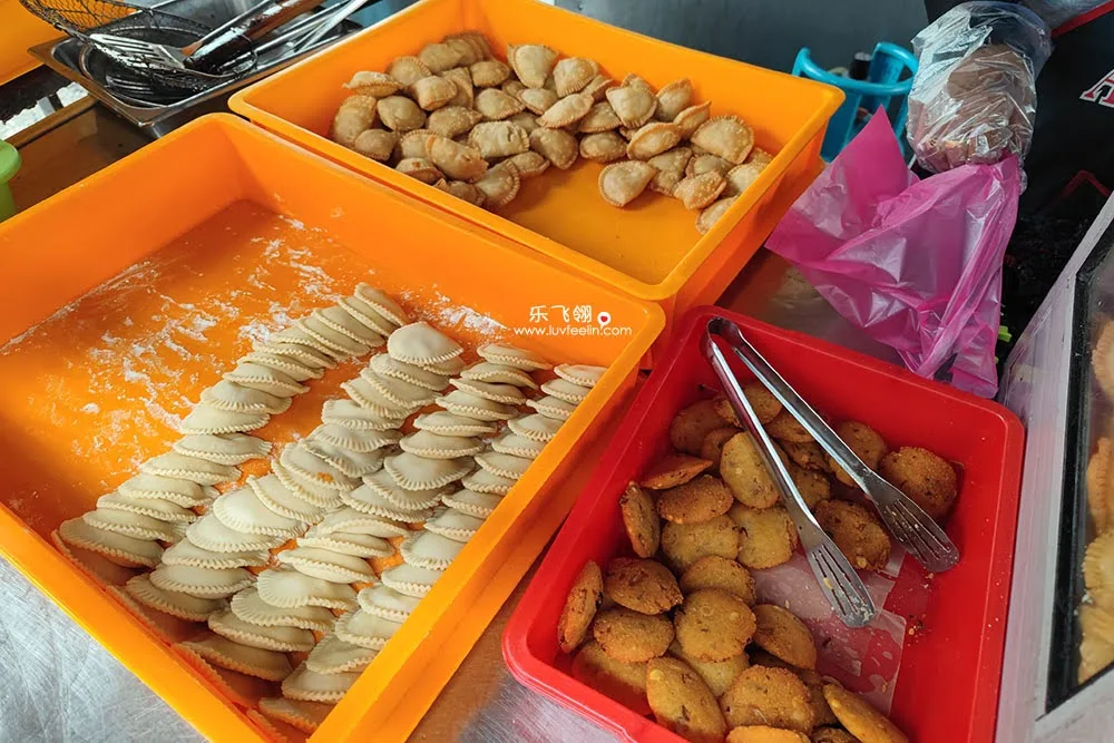 Hand-folded karipap ready for the fryer