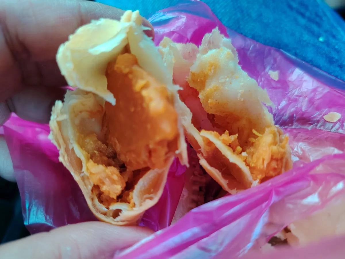 Karipap split open, curried potato filling
