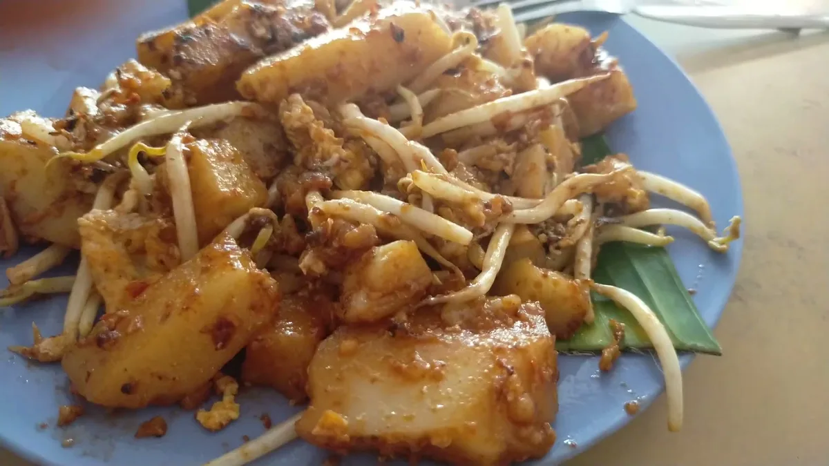 Boon Hwa char koay kak plated with beansprouts and egg