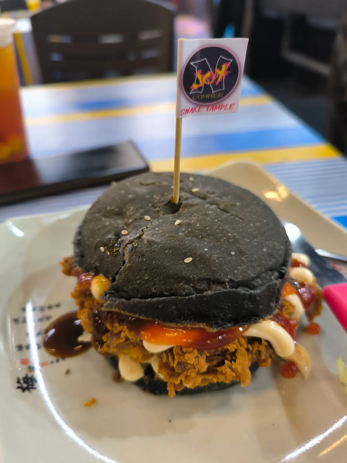 Fried chicken burger in charcoal bun