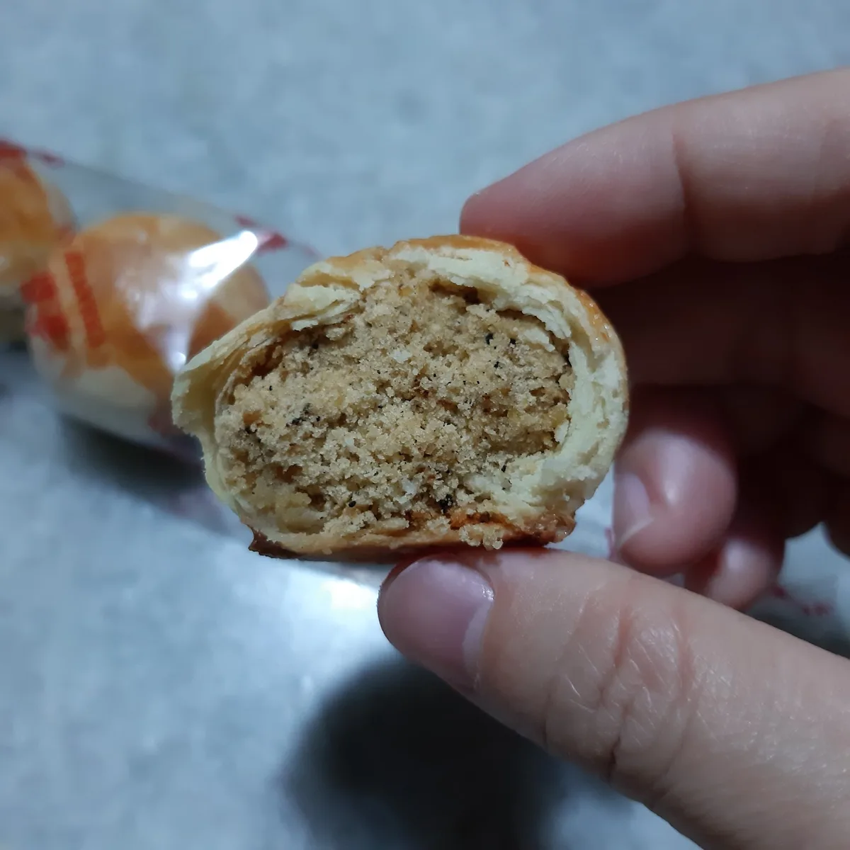 Tambun biscuit broken open to the bean filling