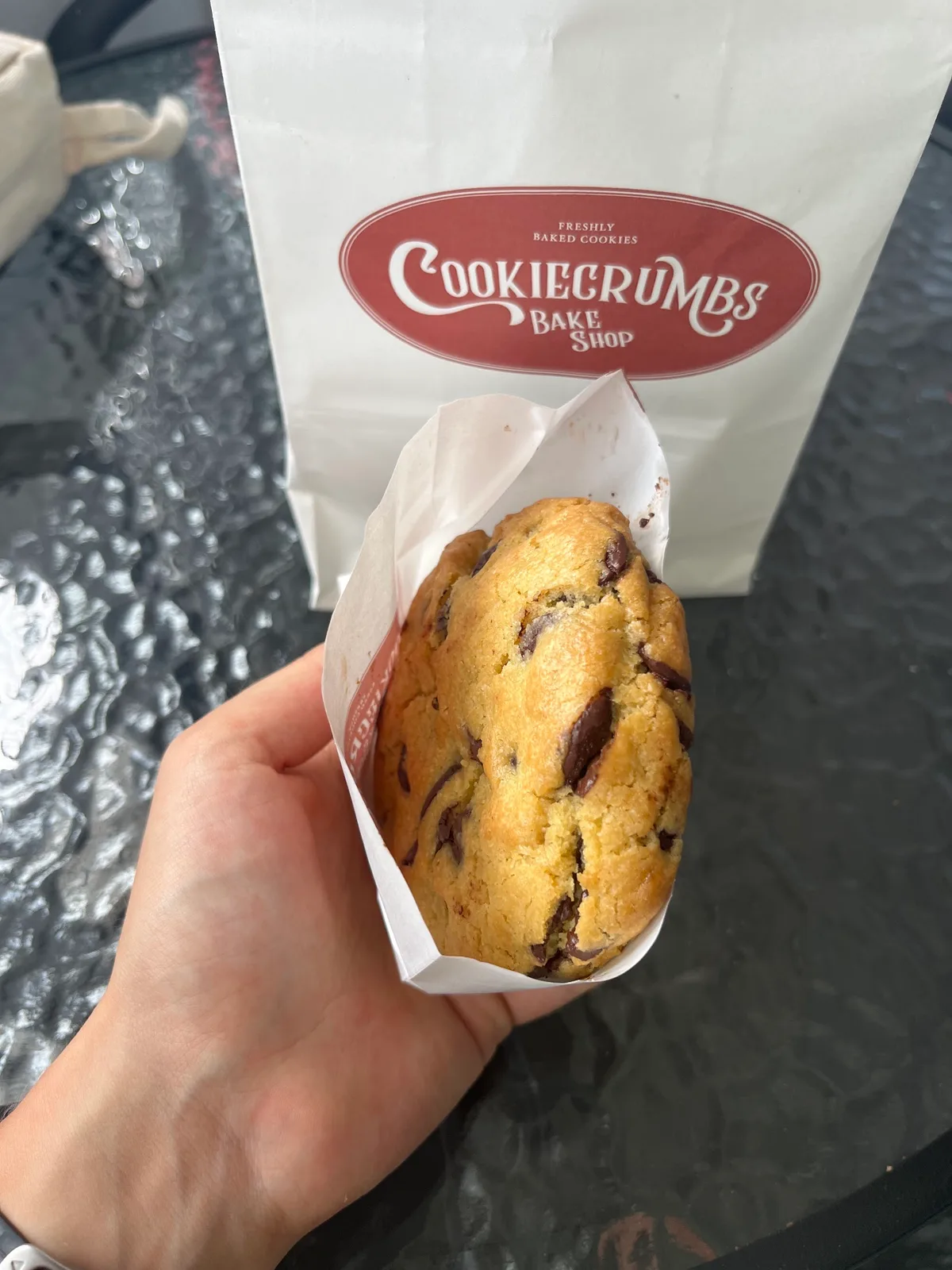 Chocolate chip cookie with the branded bag