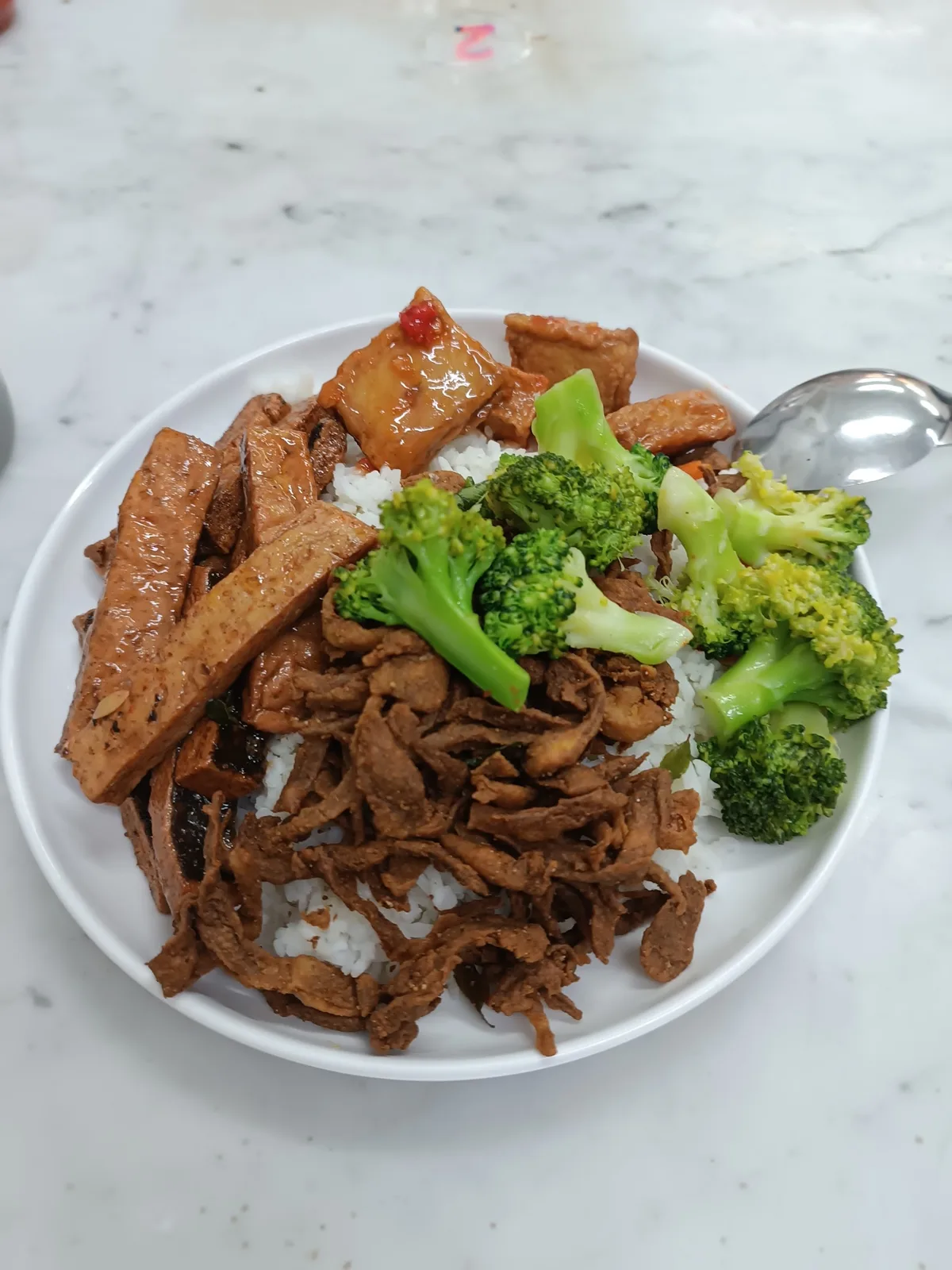 Vegetarian rice with mock meat and broccoli