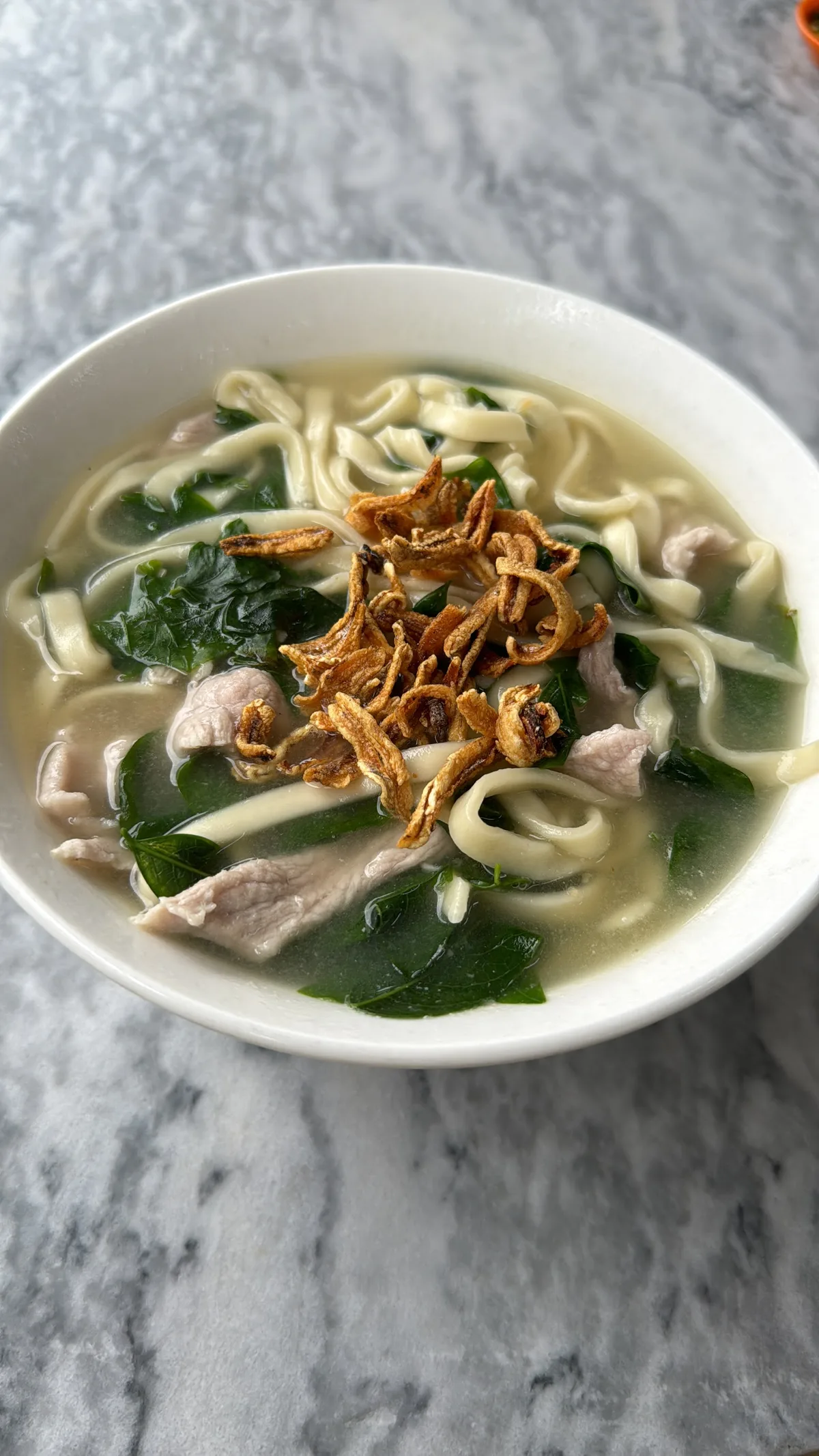 Soup ban mee with pork slices and fried shallots