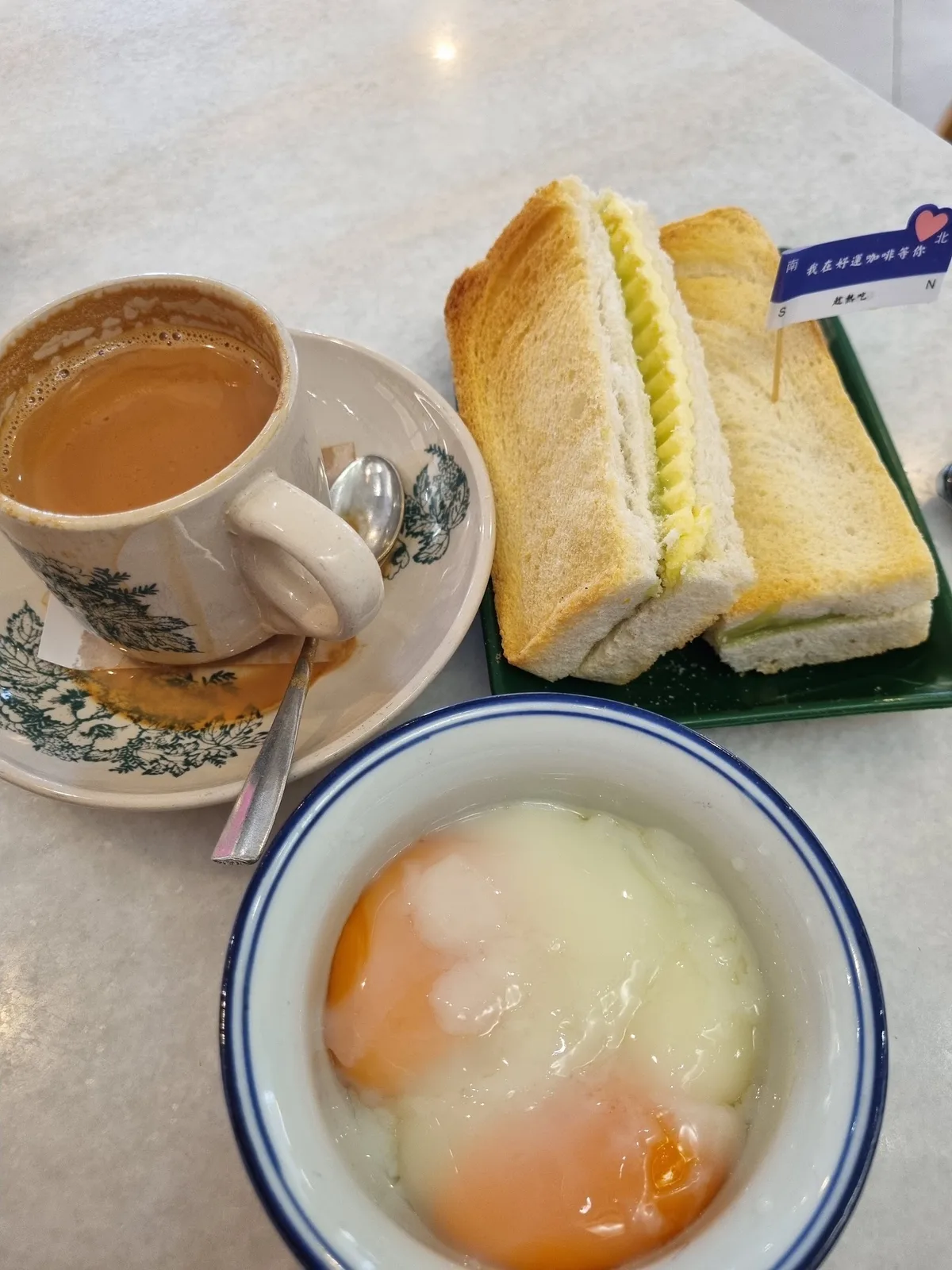 Kopi, toast and half-boiled eggs