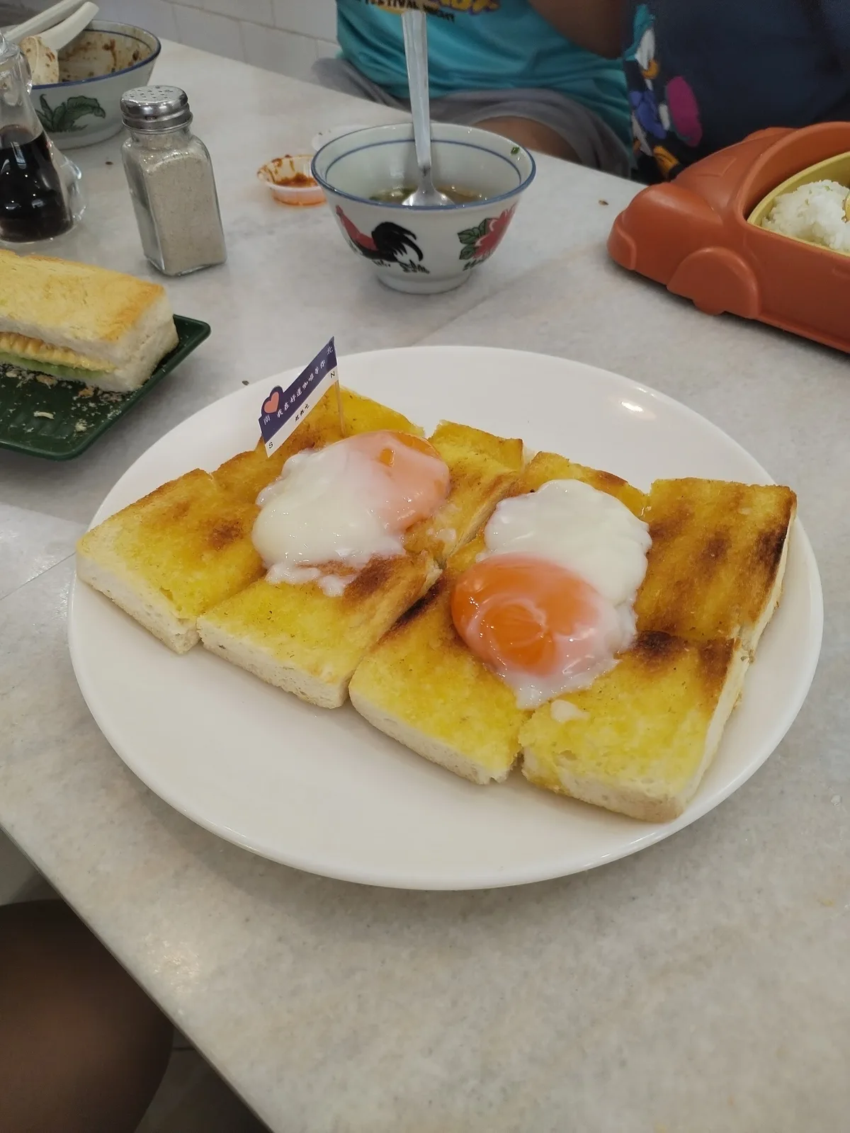 Toast topped with half-boiled eggs