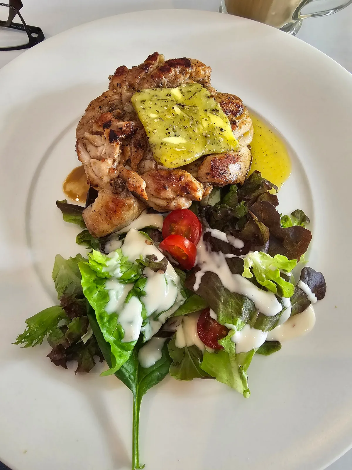 Grilled chicken with herb butter and salad