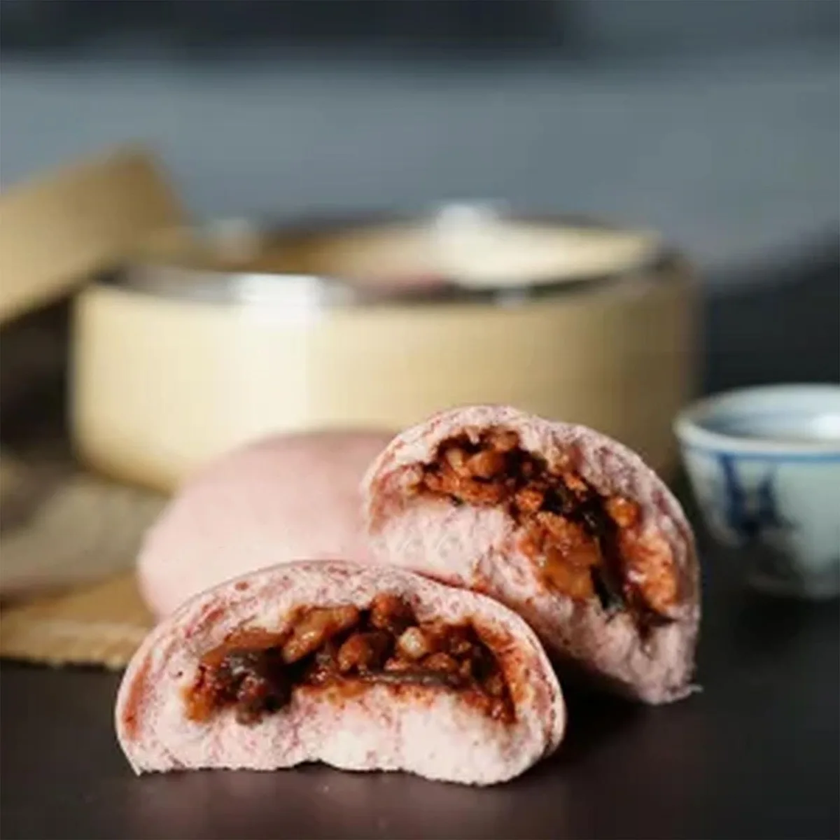 Red yeast pork bun broken open