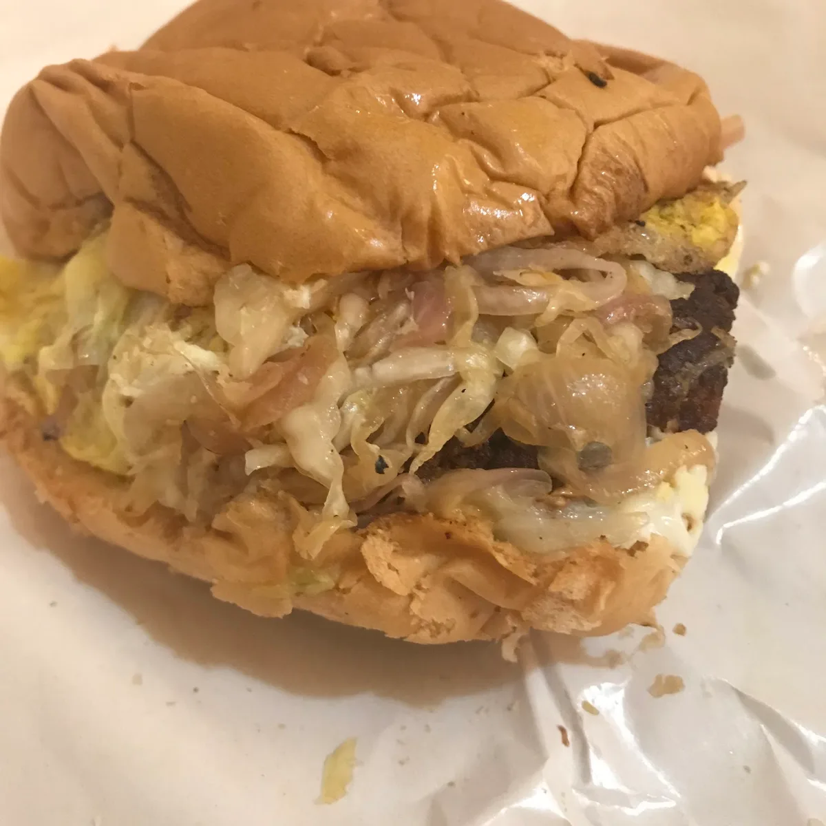 Burger with red onion and house sauce