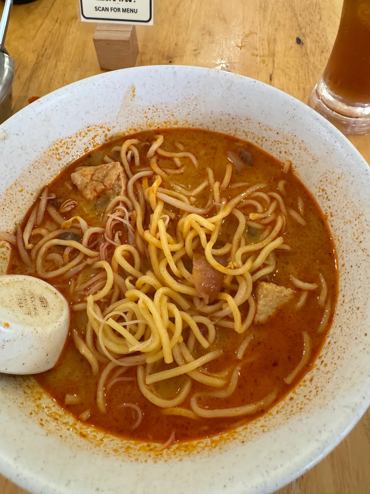 Curry mee after the chili paste is stirred through