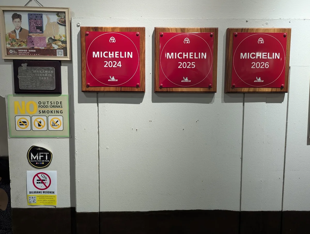 Michelin plaques for 2024, 2025 and 2026 on the wall