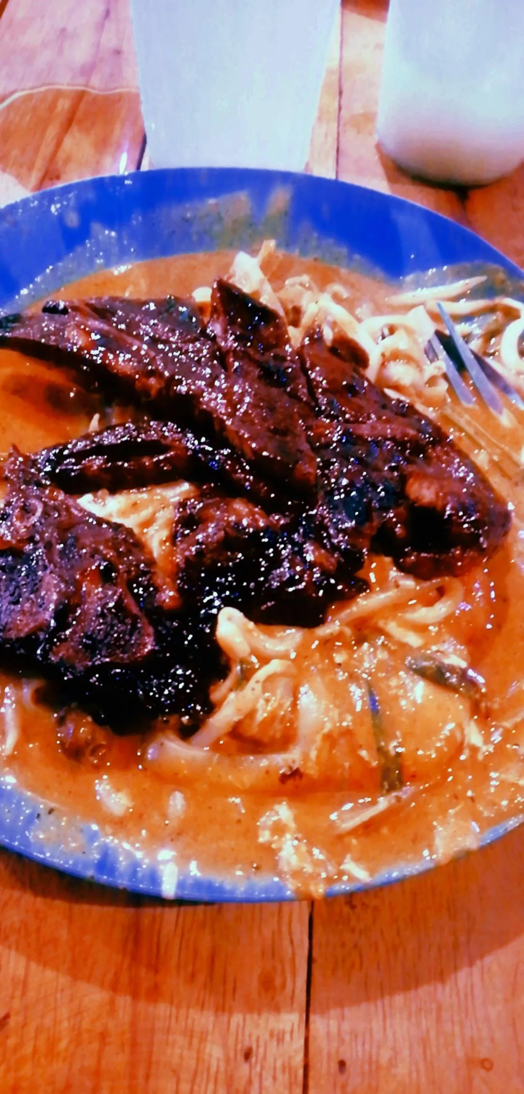 Char koay teow topped with smoked lamb