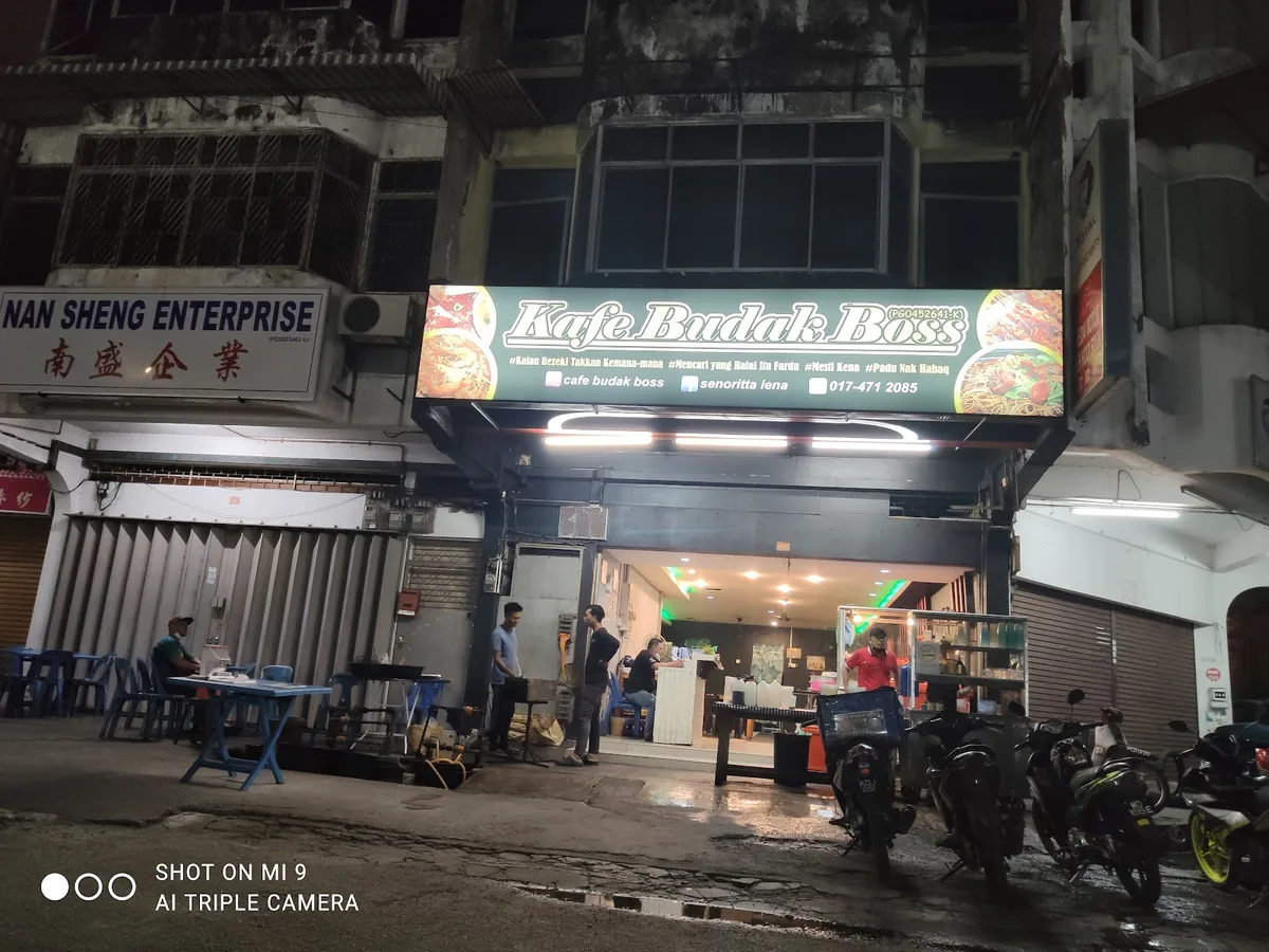 Kafe Budak Boss shopfront at night