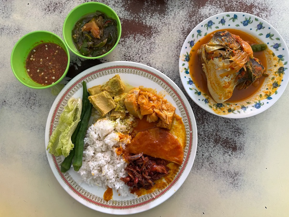 Nasi padang with fish curry and vegetables