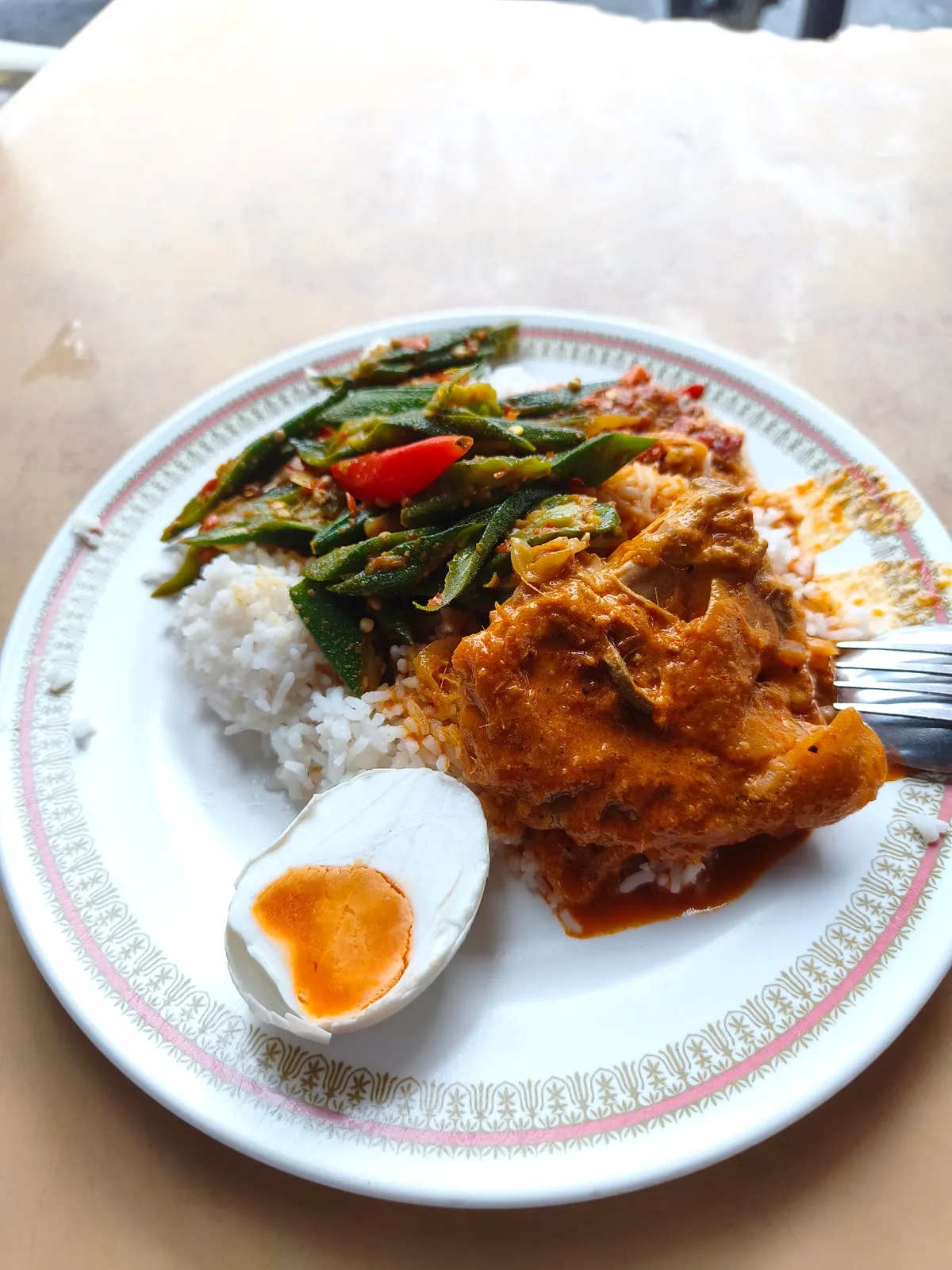 Nasi padang with fish curry, petai beans and salted egg