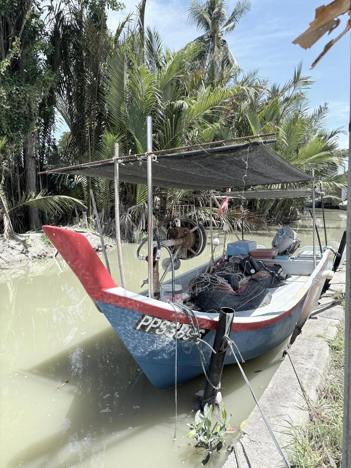 Fishing boat moored by the tables