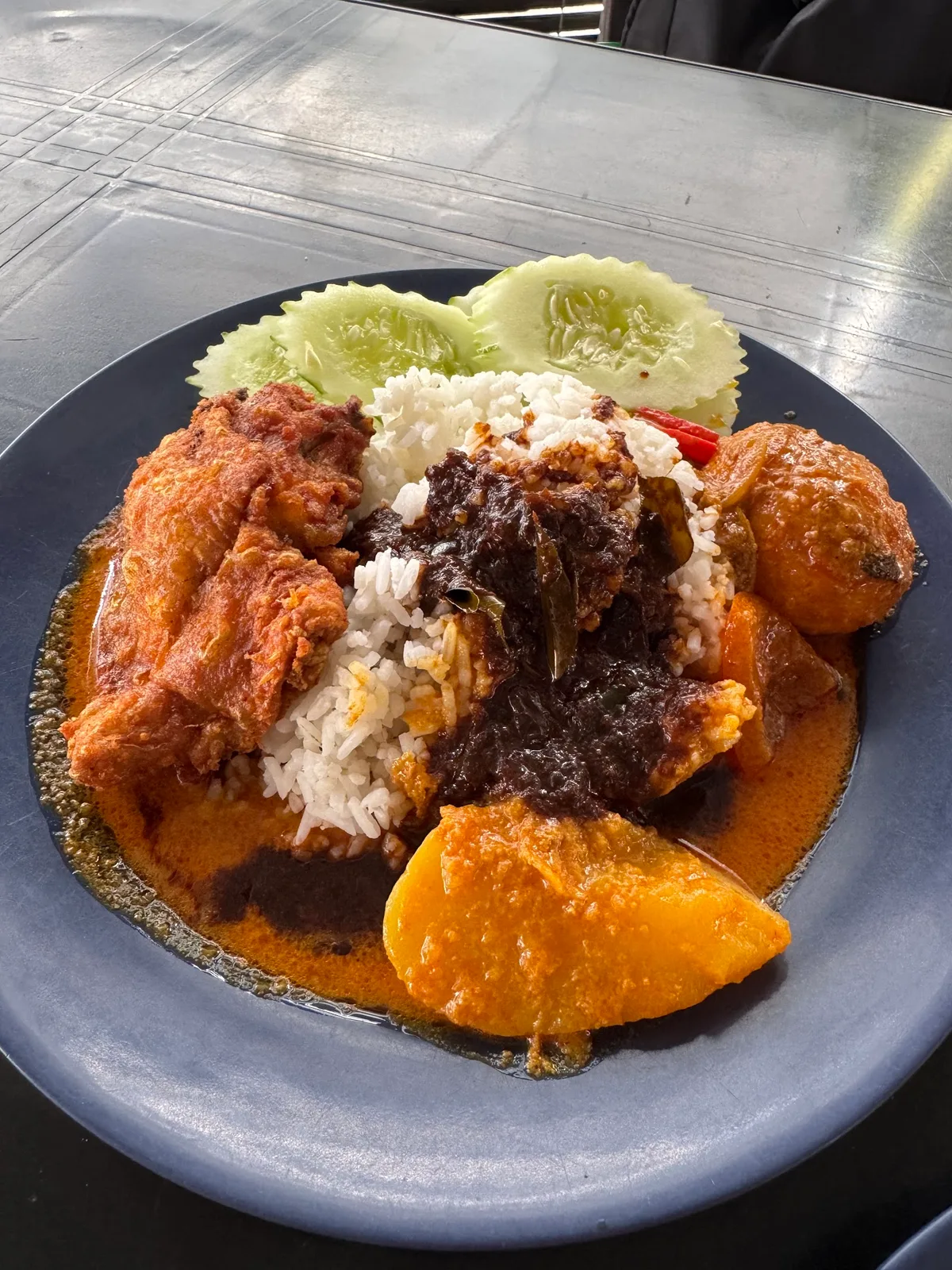 Rice topped with fried chicken and egg
