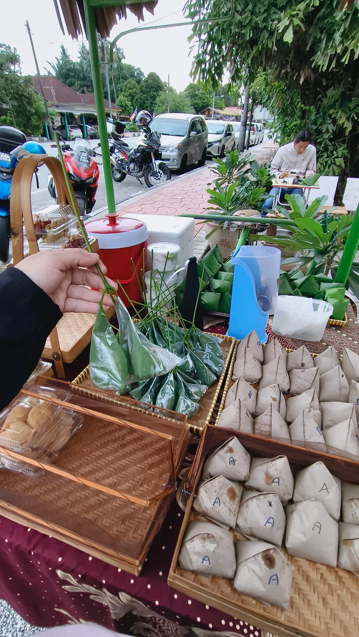 Kuih and nasi lemak bungkus at the vendor table