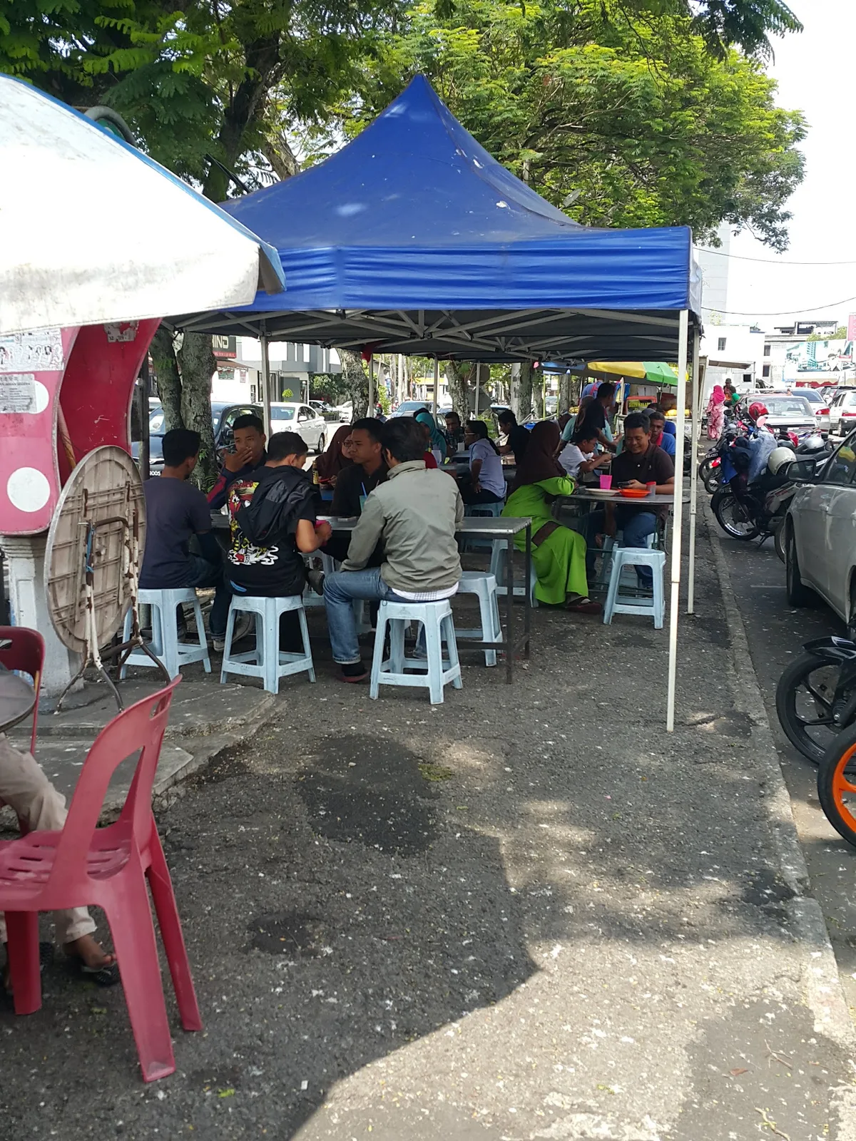 Diners under the canopy tents