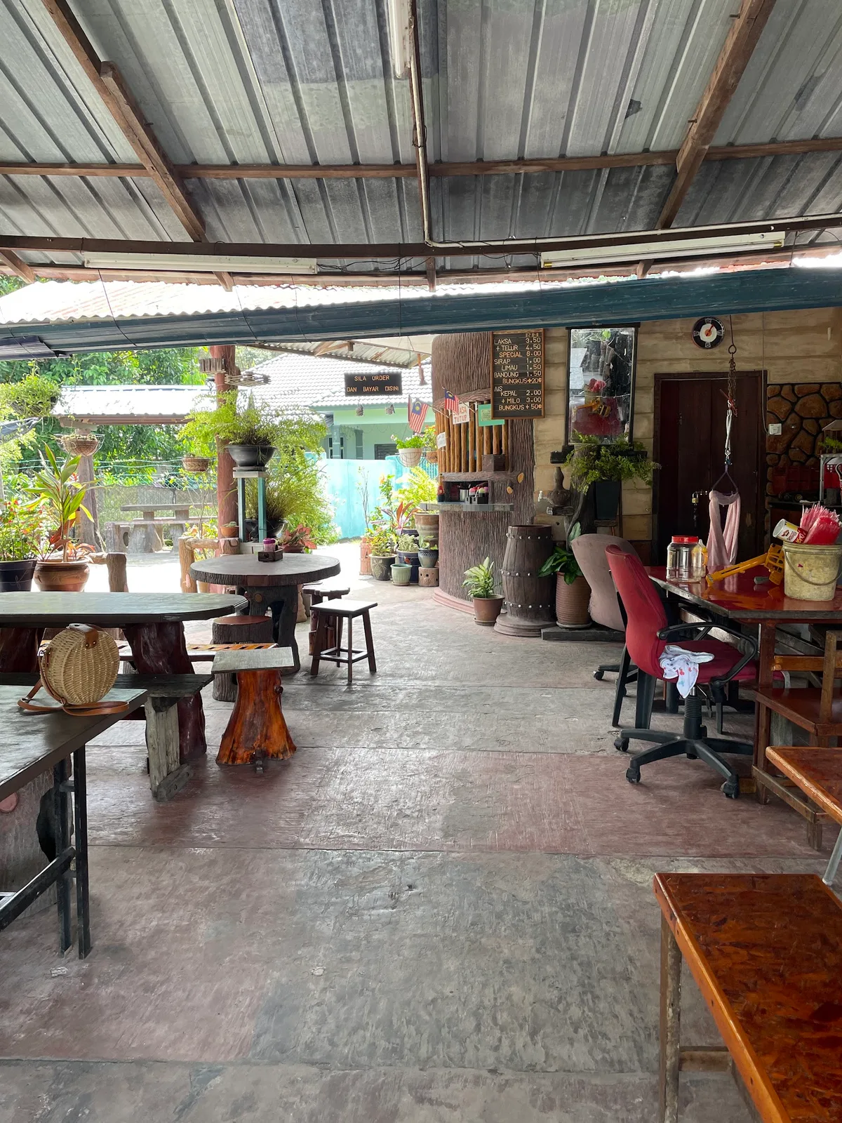 Open-air dining shed with wooden tables
