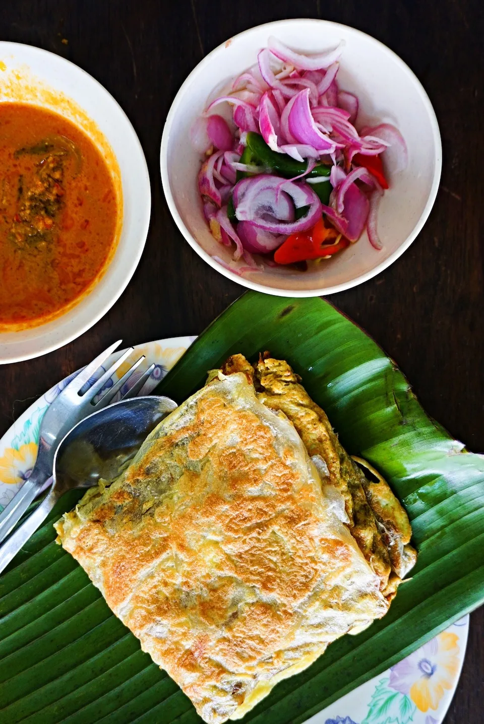 A Ghaffoor Martabak — murtabak with curry and pickled onion