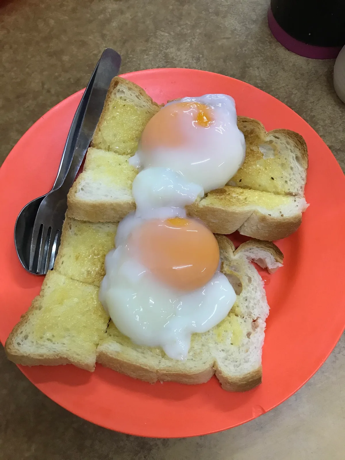 Toast topped with soft-boiled eggs