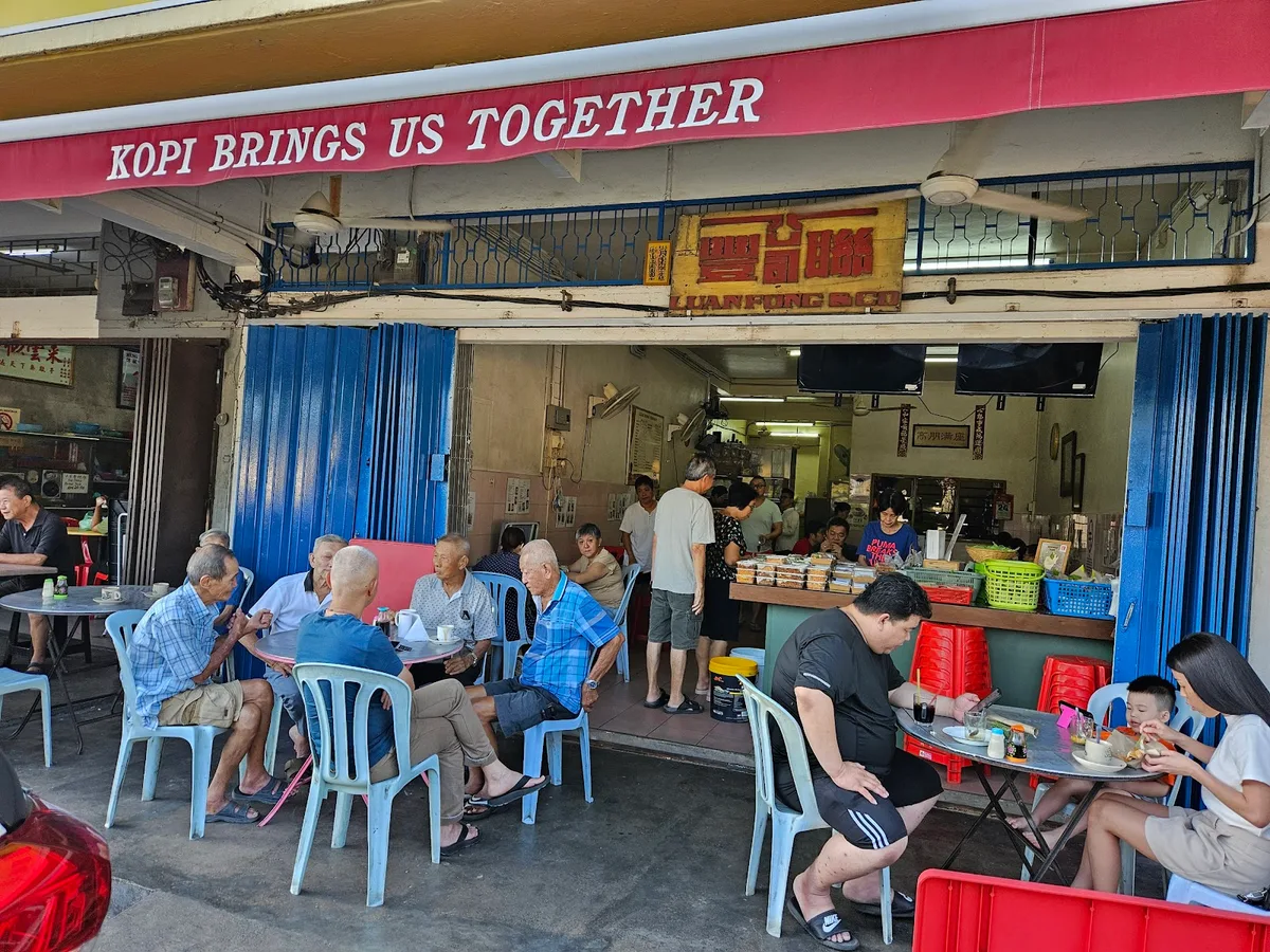 Five-foot-way tables under the Kopi Brings Us Together awning