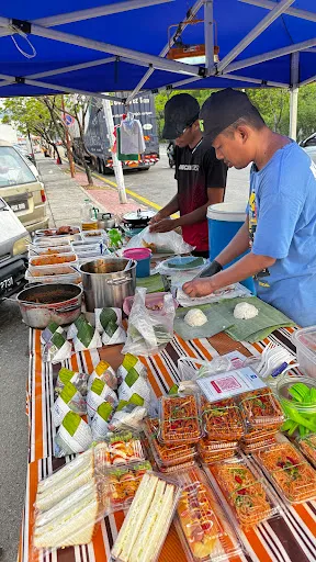 Man Nasi Lemak daun pisang OCBC — people