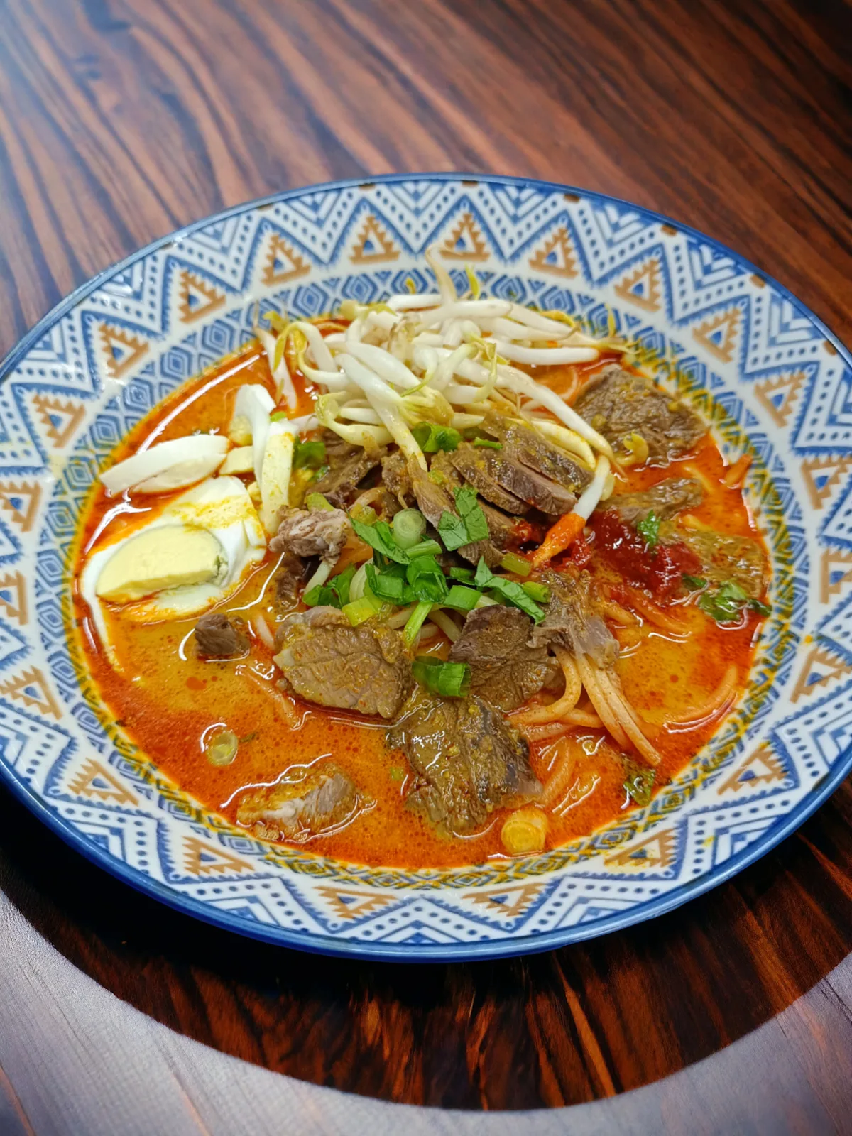 Mee kari daging in a patterned bowl