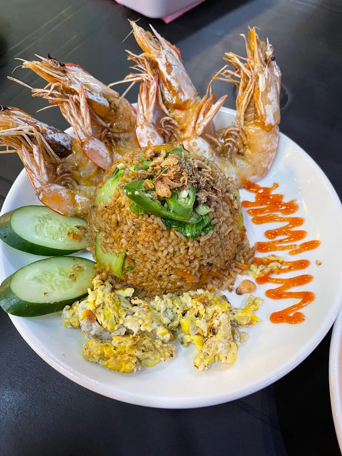 Nasi goreng ringed with fried prawns