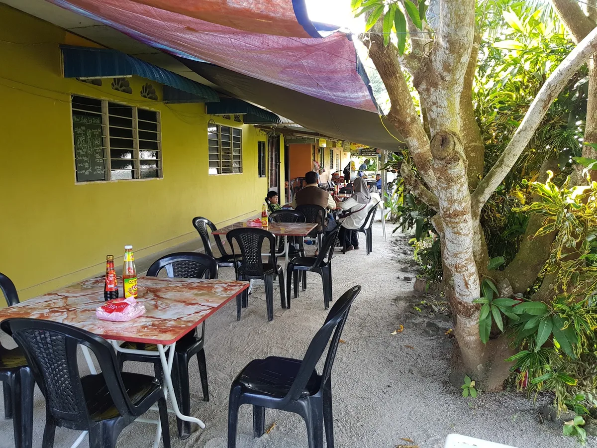 Open-air veranda seating beside the fields
