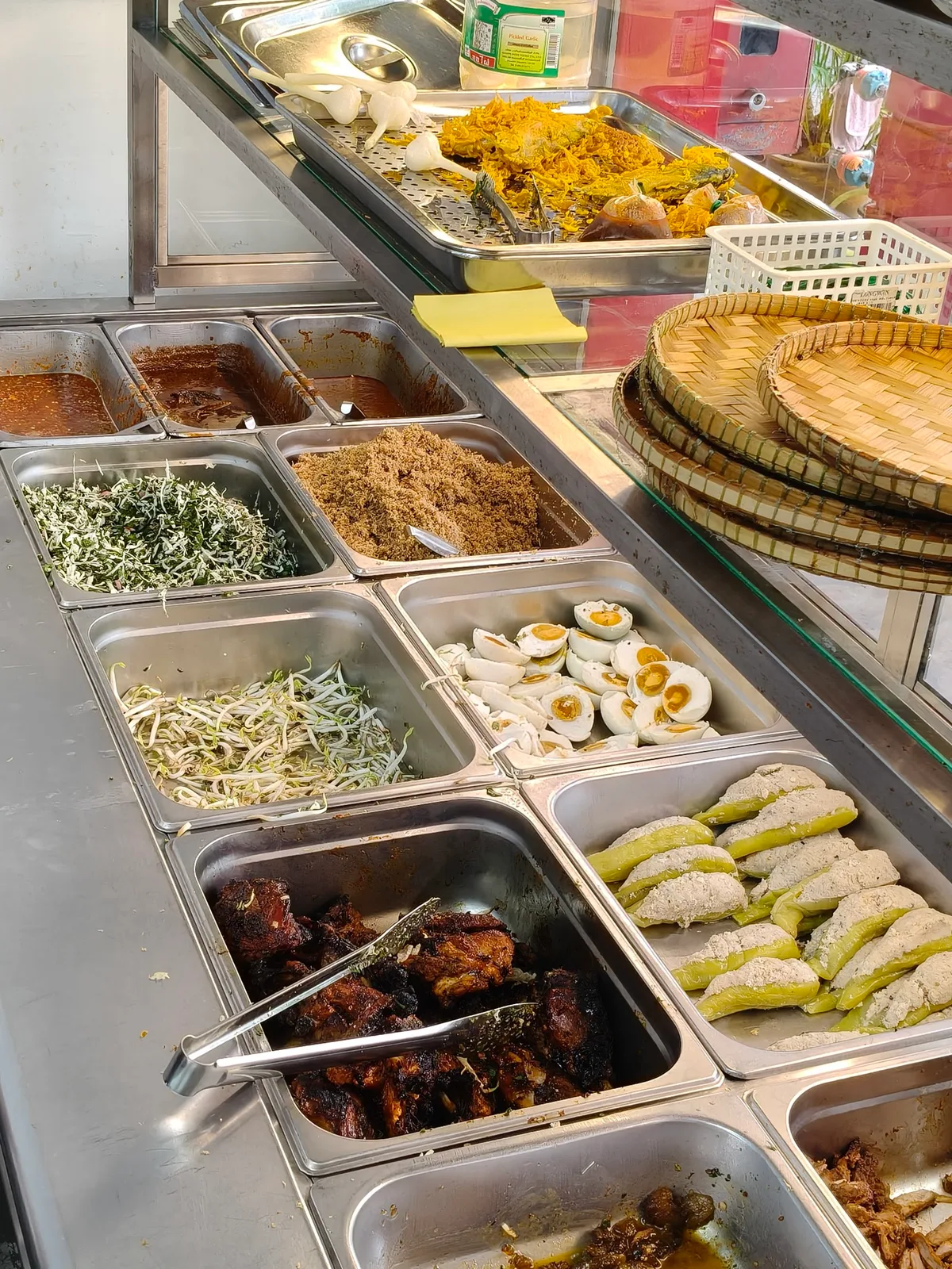 Kerabu herbs and lauk at the counter