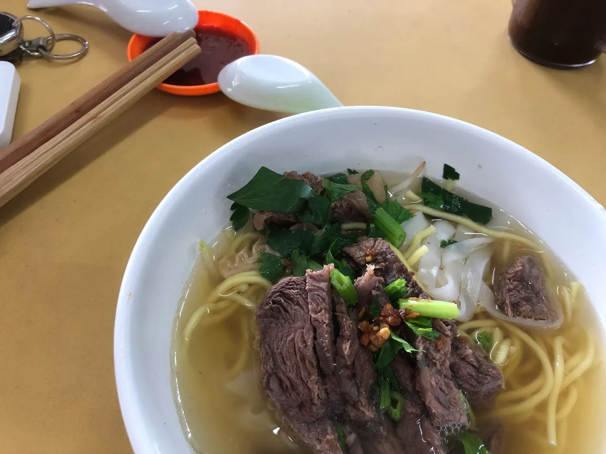 Beef noodle soup with yellow mee and koay teow
