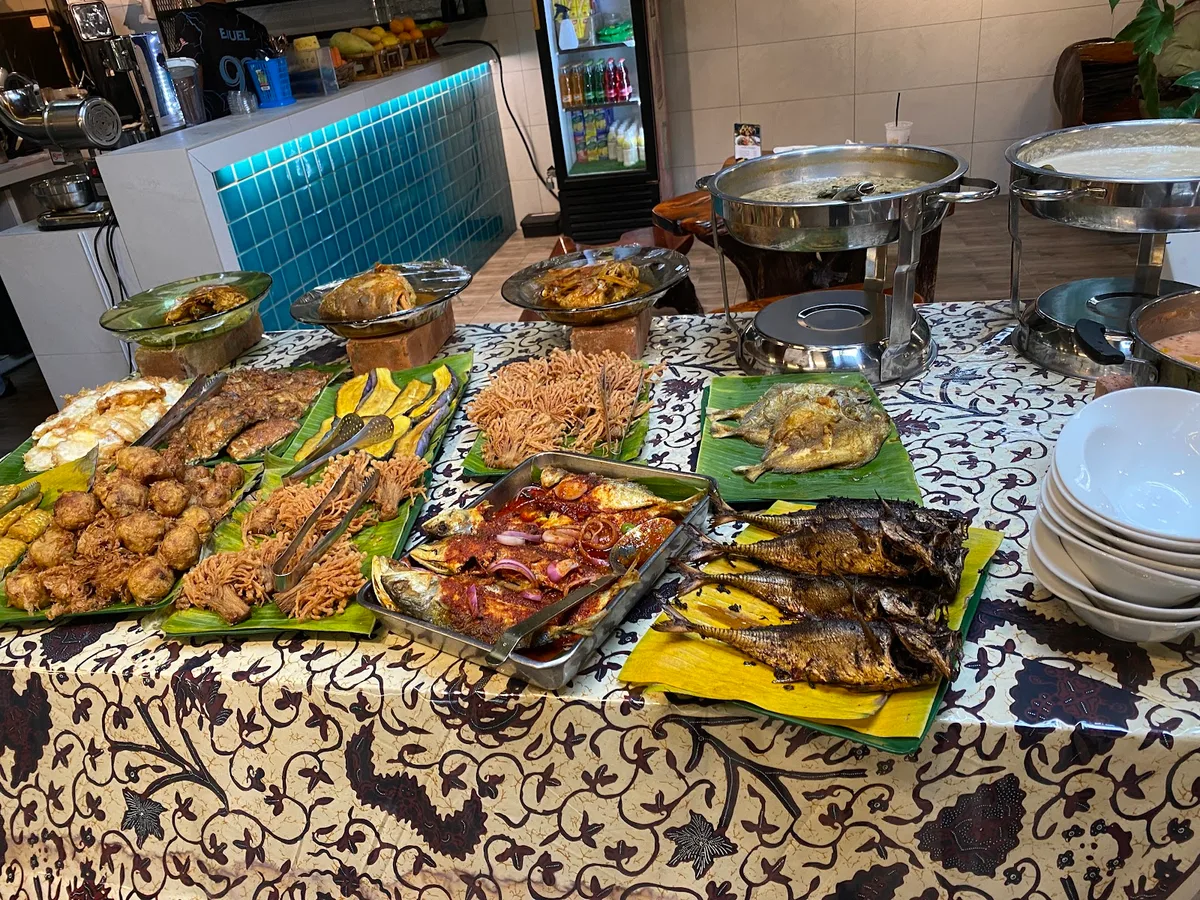 Lauk spread on banana leaves at the buffet