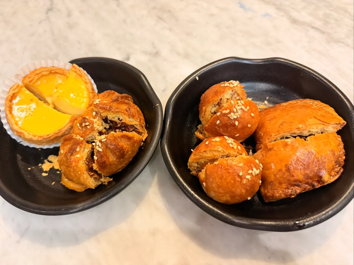 Egg tart and flaky pastries, broken open