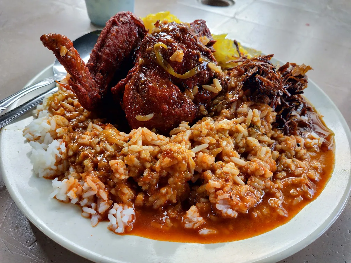 Nasi kandar flooded with gravy