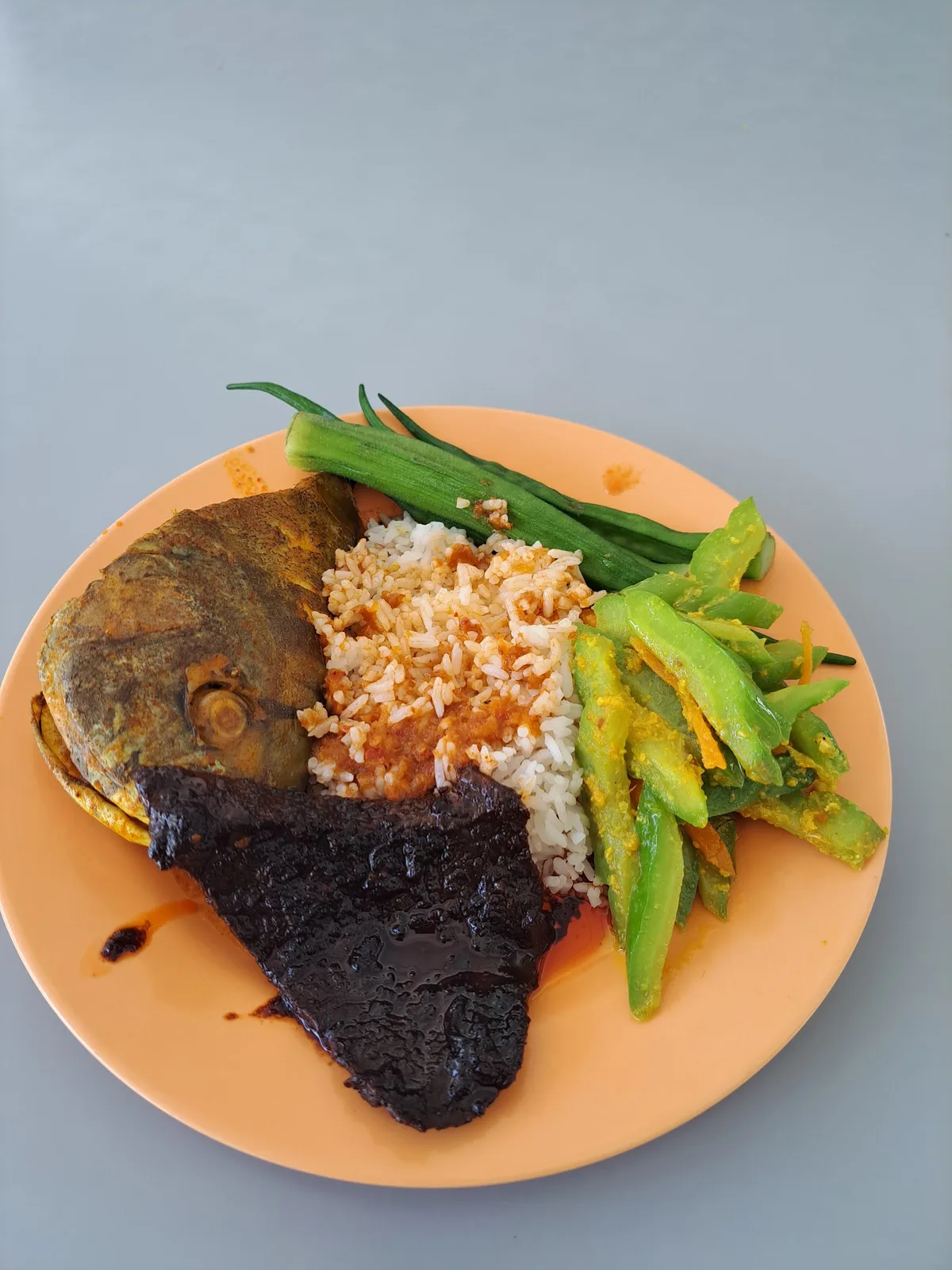Nasi campur with fried fish, beef and long beans