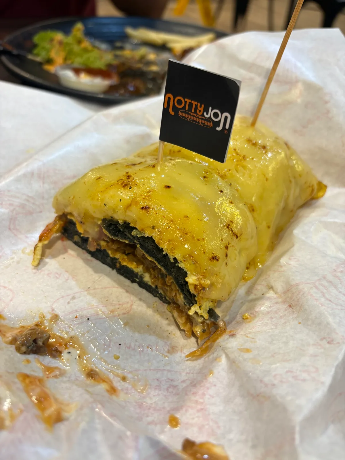 Roti john cut open with the Notty Jon flag pick
