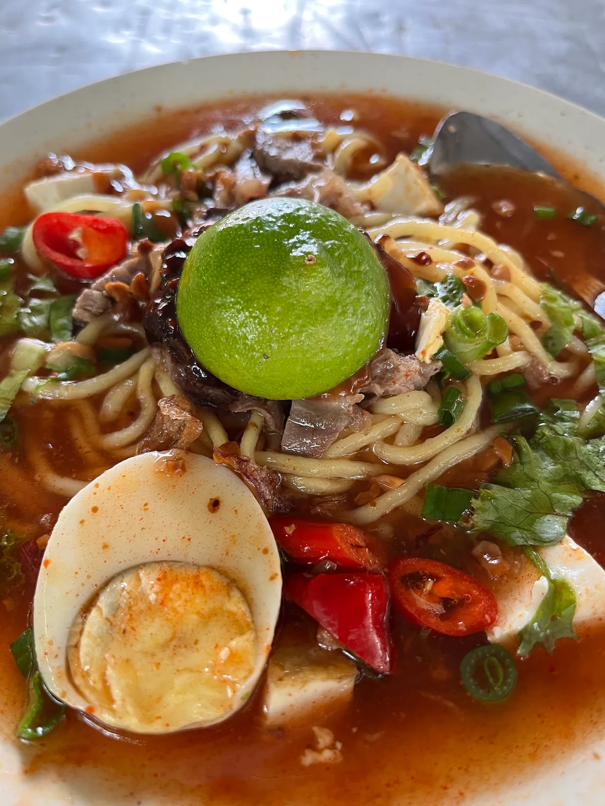 Mee kuah with egg, tofu and lime