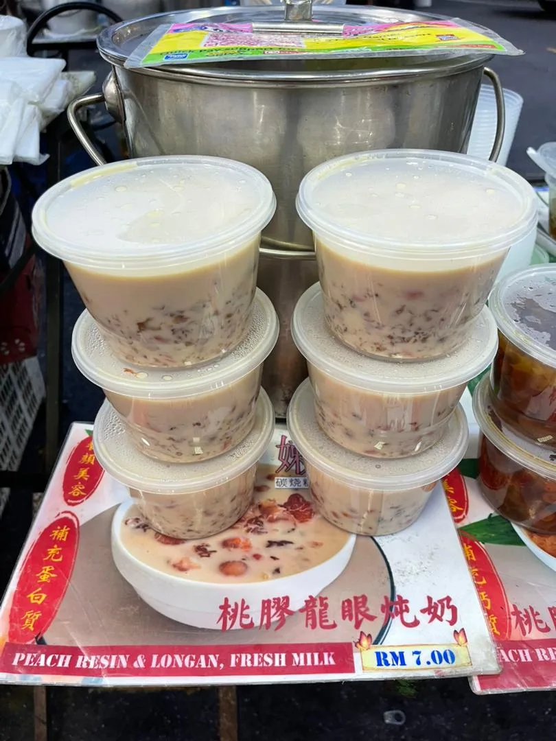 Tubs of dessert stacked on the stall